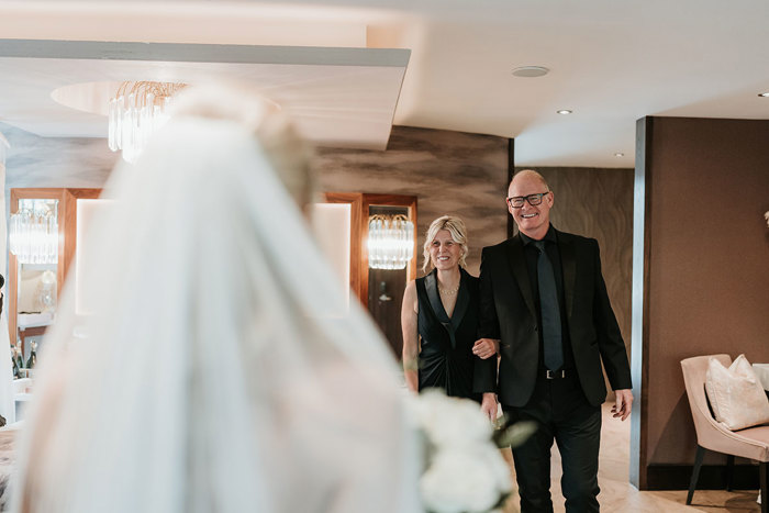 a man and a woman looking at a bride