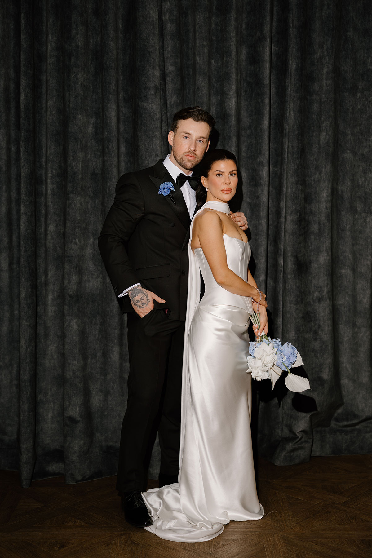 Bride and groom portrait at The Exchange Glasgow with blue hydrangea bouquet and modern bridal styling