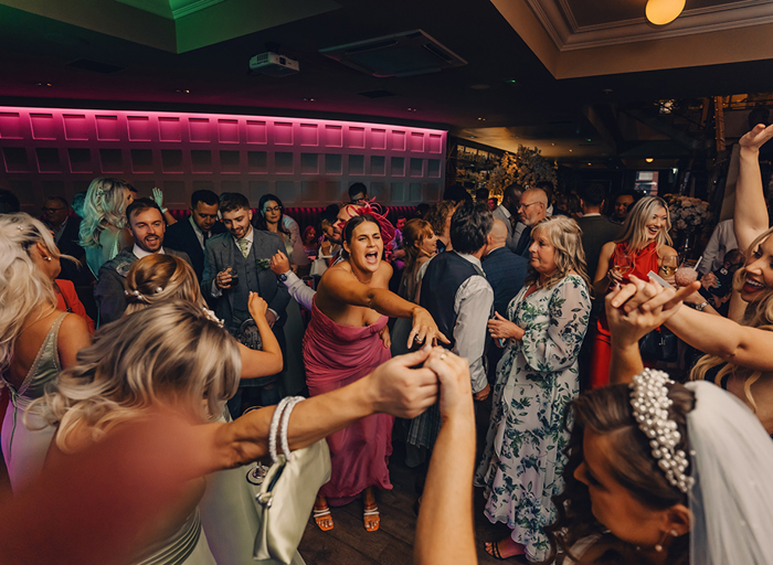 guests on busy dancefloor dancing