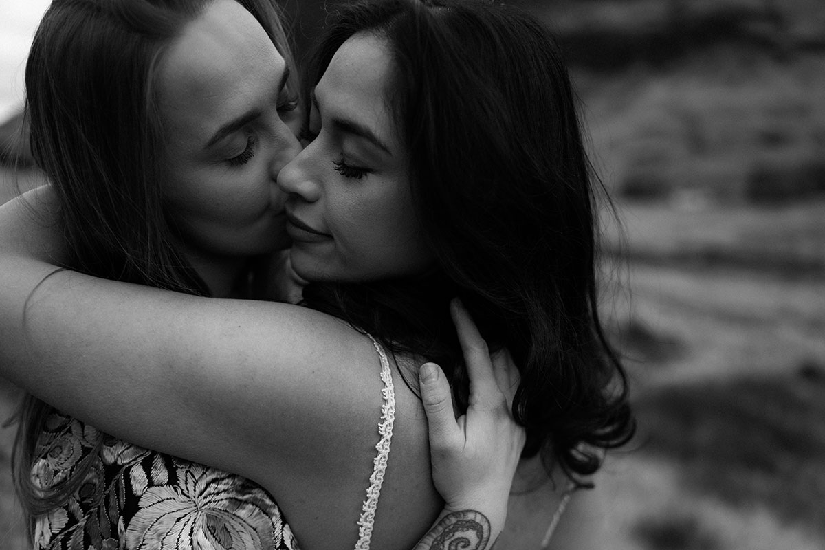 Close-up black and white portrait of a couple embracing during an intimate Scottish elopement shoot in Glencoe.