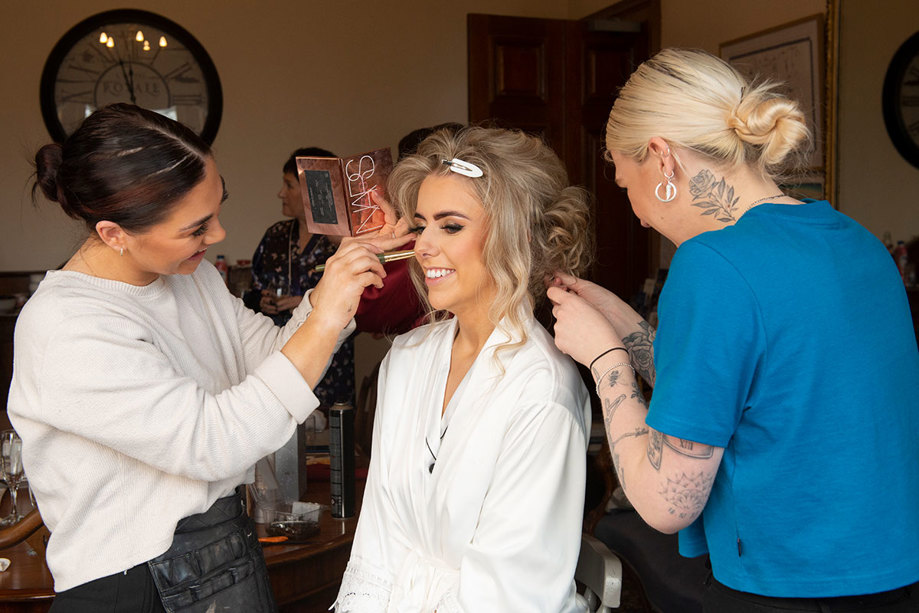 A Bride Getting Her Hair And Makeup Done