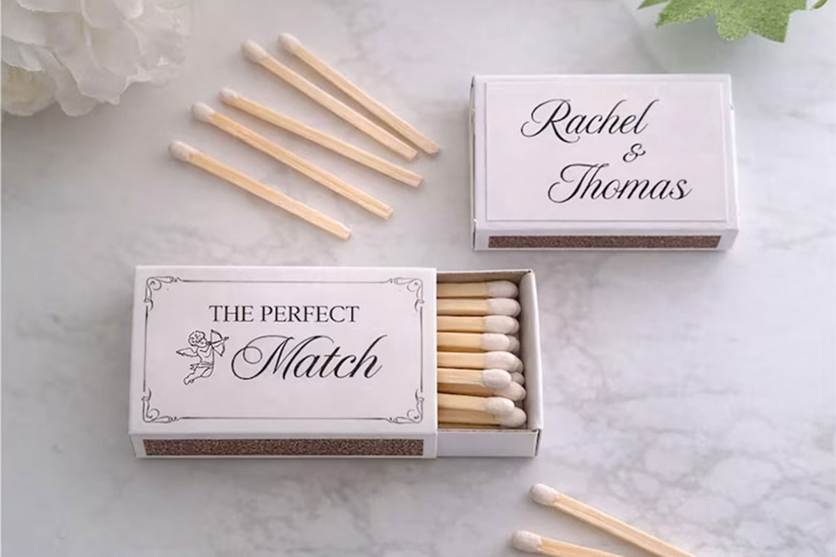 Personalised matchbox wedding favours with romantic wording and couple’s names