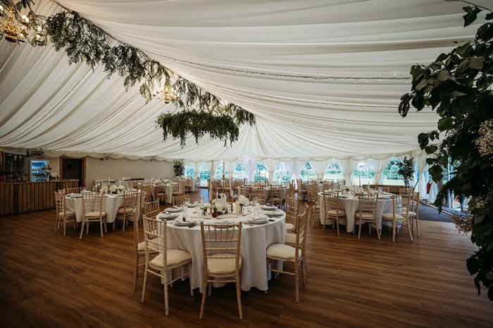Marquee At Boswells Estate Dressed For A Wedding With Round Tables And Chiavari Chairs