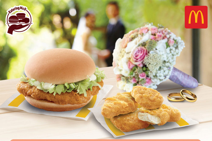 Image showing burger and chicken nuggets from McDonald's alongside a bridal bouquet and wedding rings