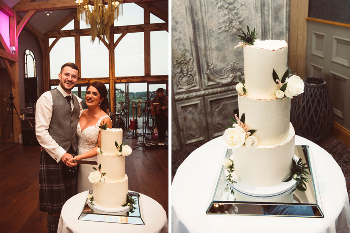 Bride and groom cutting three-tier white wedding cake