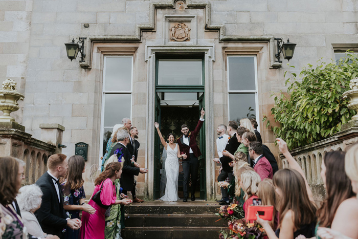 Bride And Groom Confetti Shower On Stairs At Netherbyres House