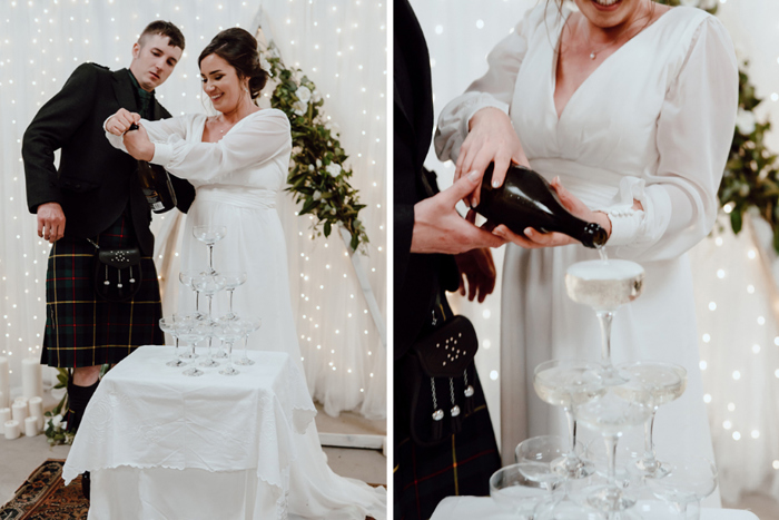 Couple pouring champagne tower