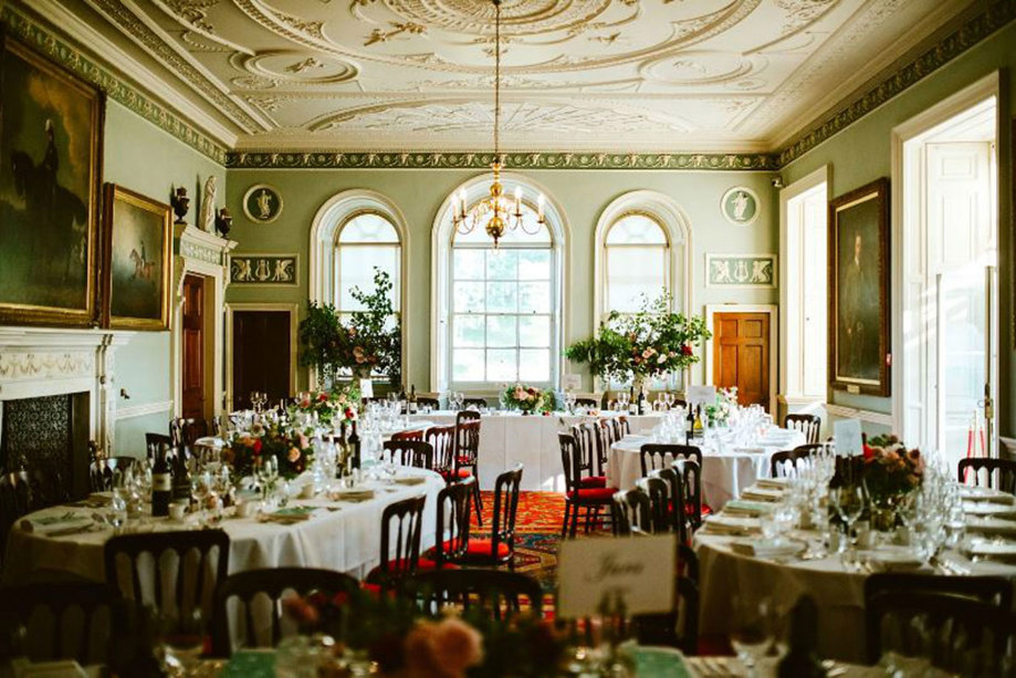 dinner set up with wooden chairs and floral centrepieces at culzean castle
