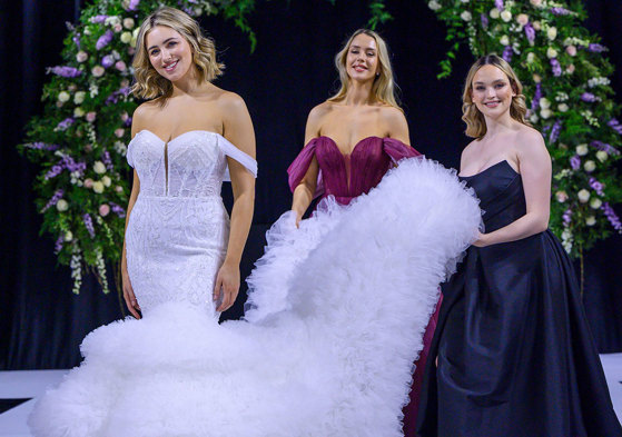 a bride model and two bridesmaid models on the catwalk at the Scottish Wedding Show