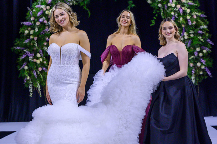 a bride model and two bridesmaid models on the catwalk at the Scottish Wedding Show