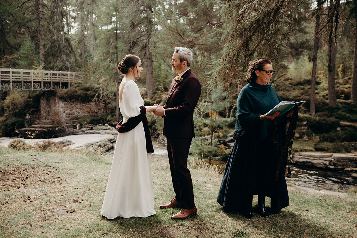 Outdoor wedding ceremony on River Quoich at Mar Lodge Estate