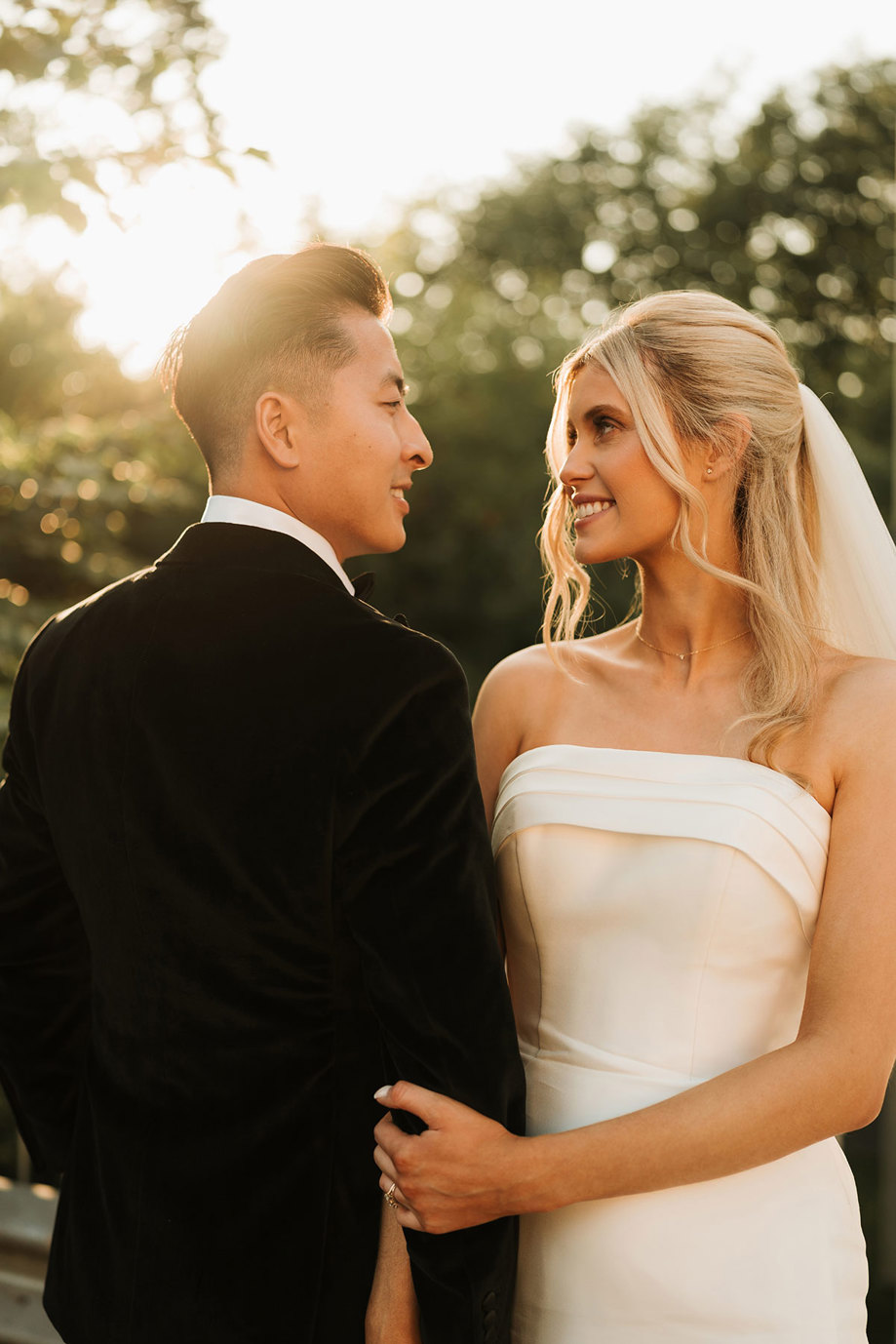 a bride and groom portrait with soft golden sunlight 