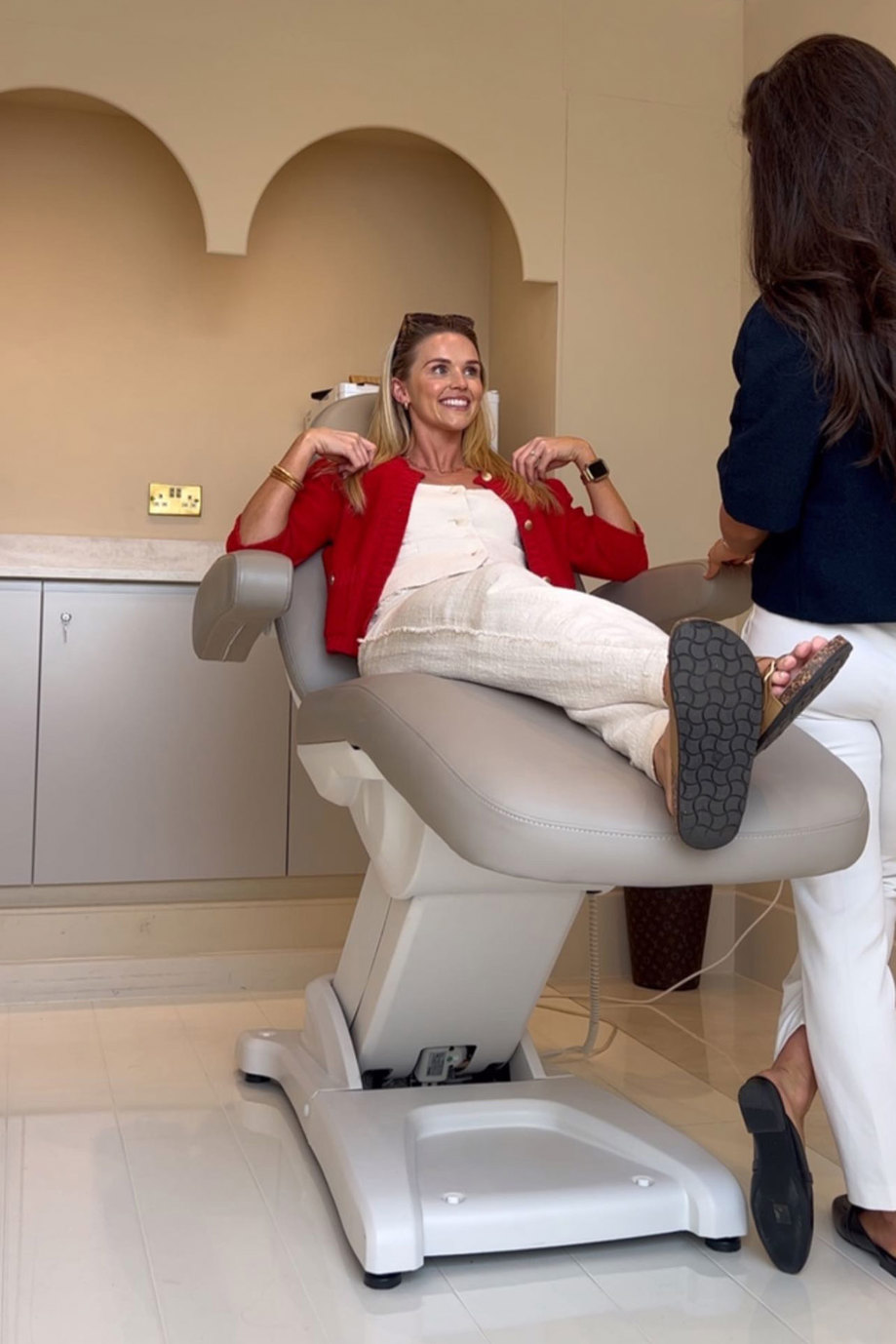 Antonia Healy lying on a treatment bed at Skinz Aesthetics clinic