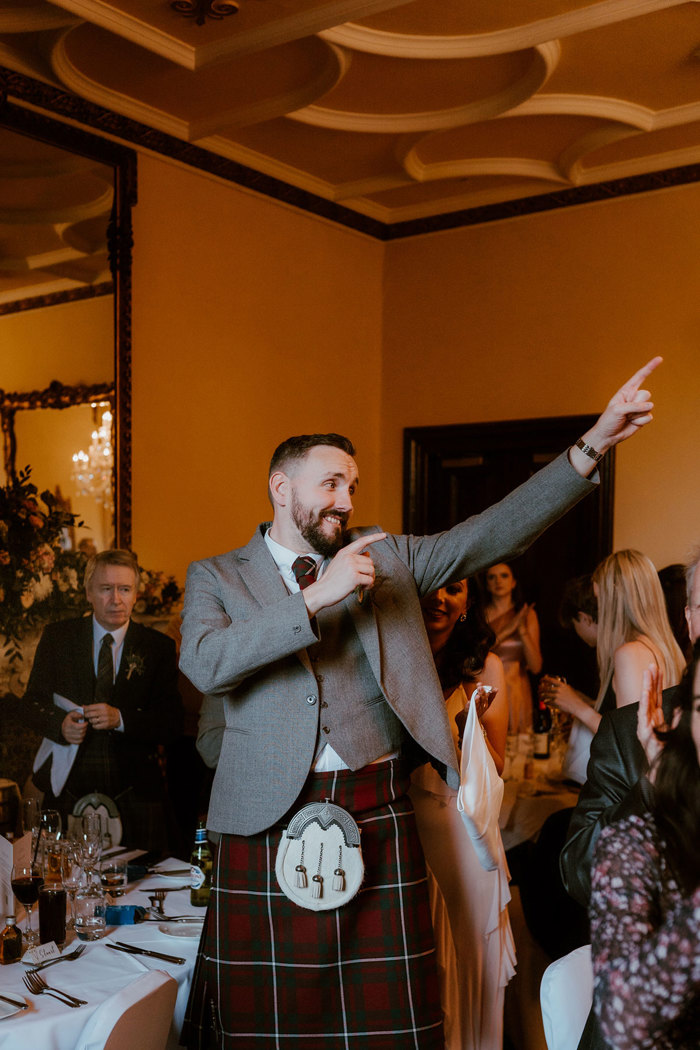 male dancing at wedding dinner at dalhousie castle