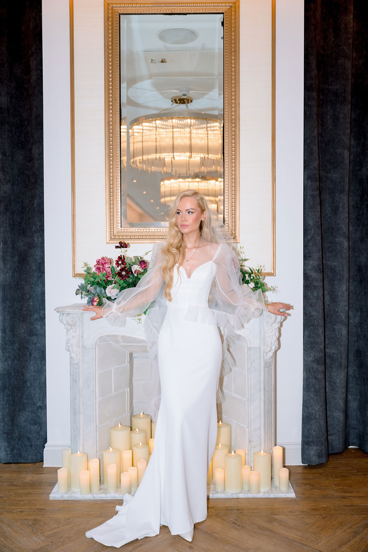 Bride posing by candlelit fireplace at The Exchange Glasgow wedding venue.