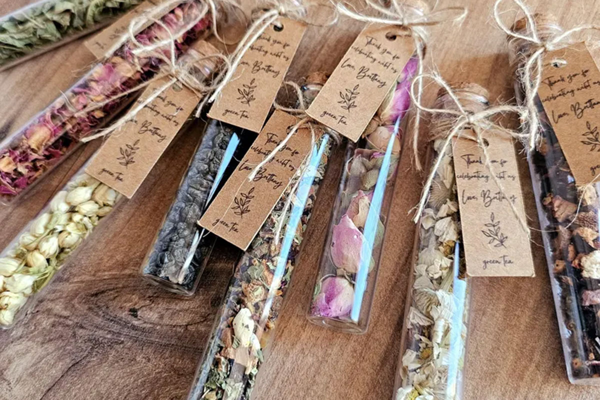 Loose leaf tea wedding favours in glass test tubes with rustic personalised tags