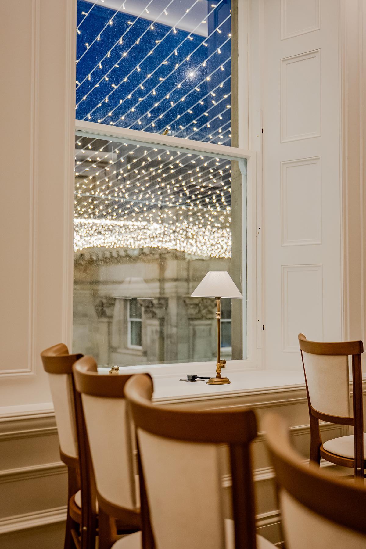 Wedding ceremony setup at The Exchange Glasgow with elegant neutral interiors and city views
