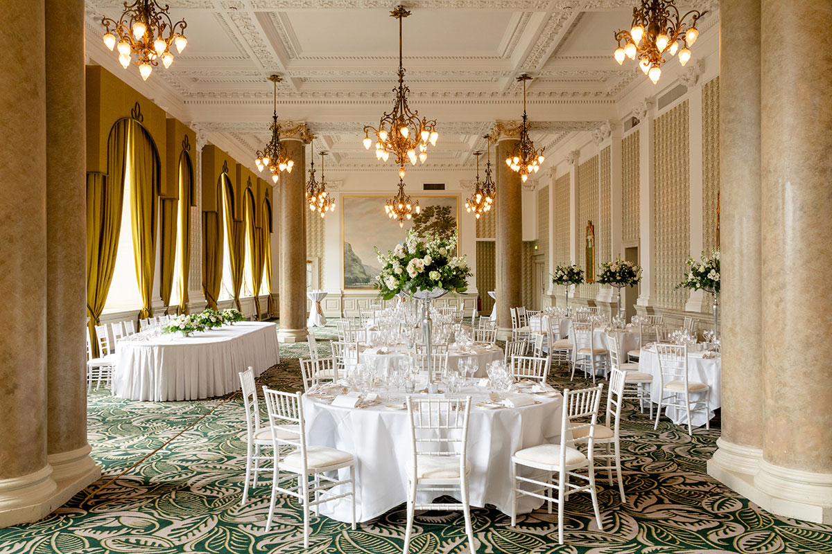 Sir Walter Scott Suite at The Balmoral Edinburgh set for a luxury wedding breakfast with elegant floral centrepieces