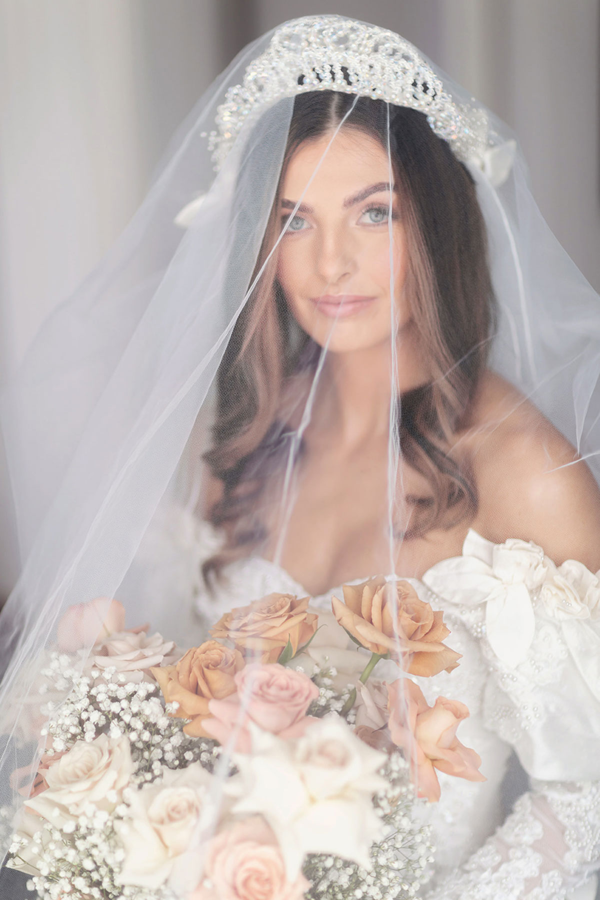 Bride wearing her mum’s vintage 1994 wedding dress and crystal tiara, holding blush and rust rose bouquet at Old Course Hotel St Andrews