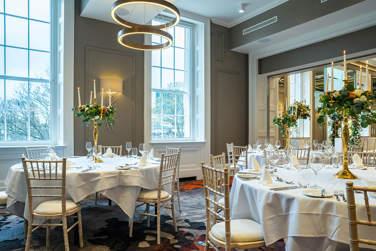 dinner set up with Chivari Chairs and gold centrepieces at clayton hotel glasgow