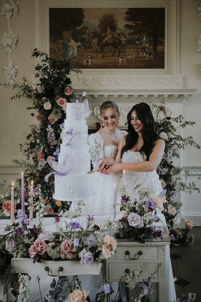 brides cutting cake together Chatelherault shoot