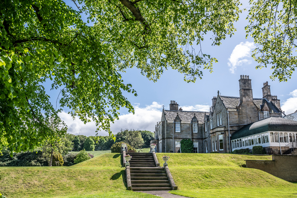 Exterior of Norton House Hotel, a grand country house surrounded by landscaped gardens in Edinburgh