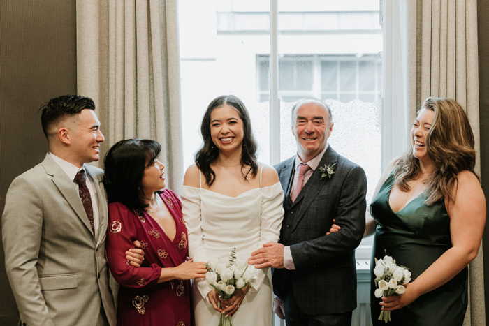 Bride with family and bridesmaid