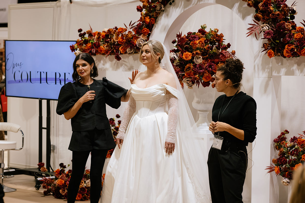 Wedding dress styling talk on stage at the Scottish Wedding Show with model in bridal gown
