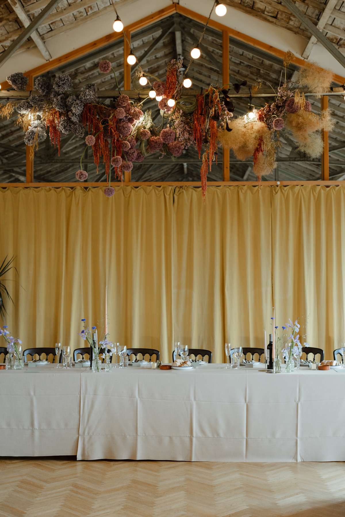 Civic House Glasgow wedding reception with long tables and hanging flowers