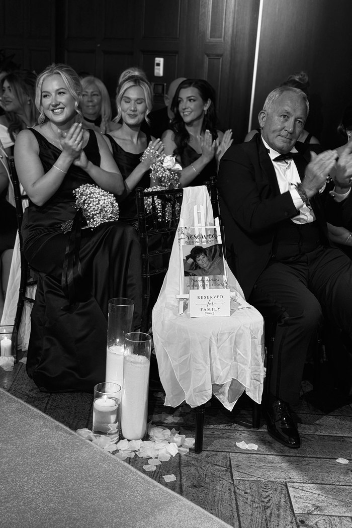 black and white picture of guests clapping their hands during wedding at kimpton blythswood square