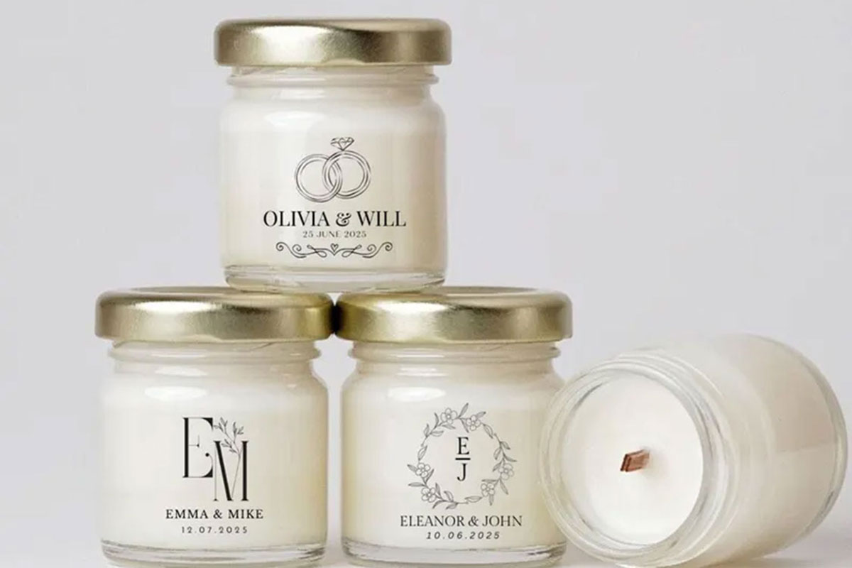 Personalised mini candle wedding favours in glass jars with gold lids