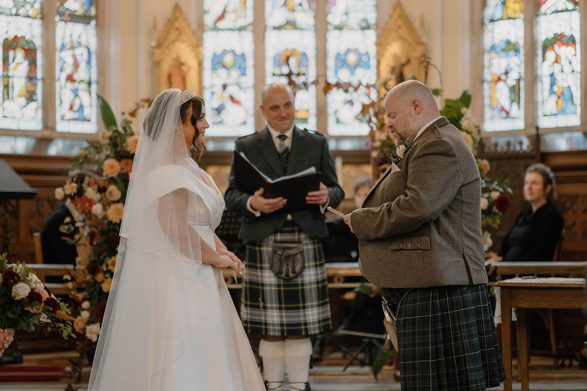 Wedding ceremony inside the historic chapel at Cluny Castle, an exclusive-use Aberdeenshire wedding venue.