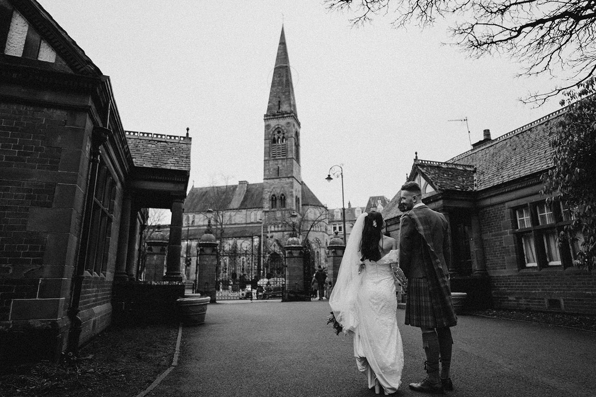 Bride and groom walking outside Òran Mór wedding venue in Glasgow’s West End