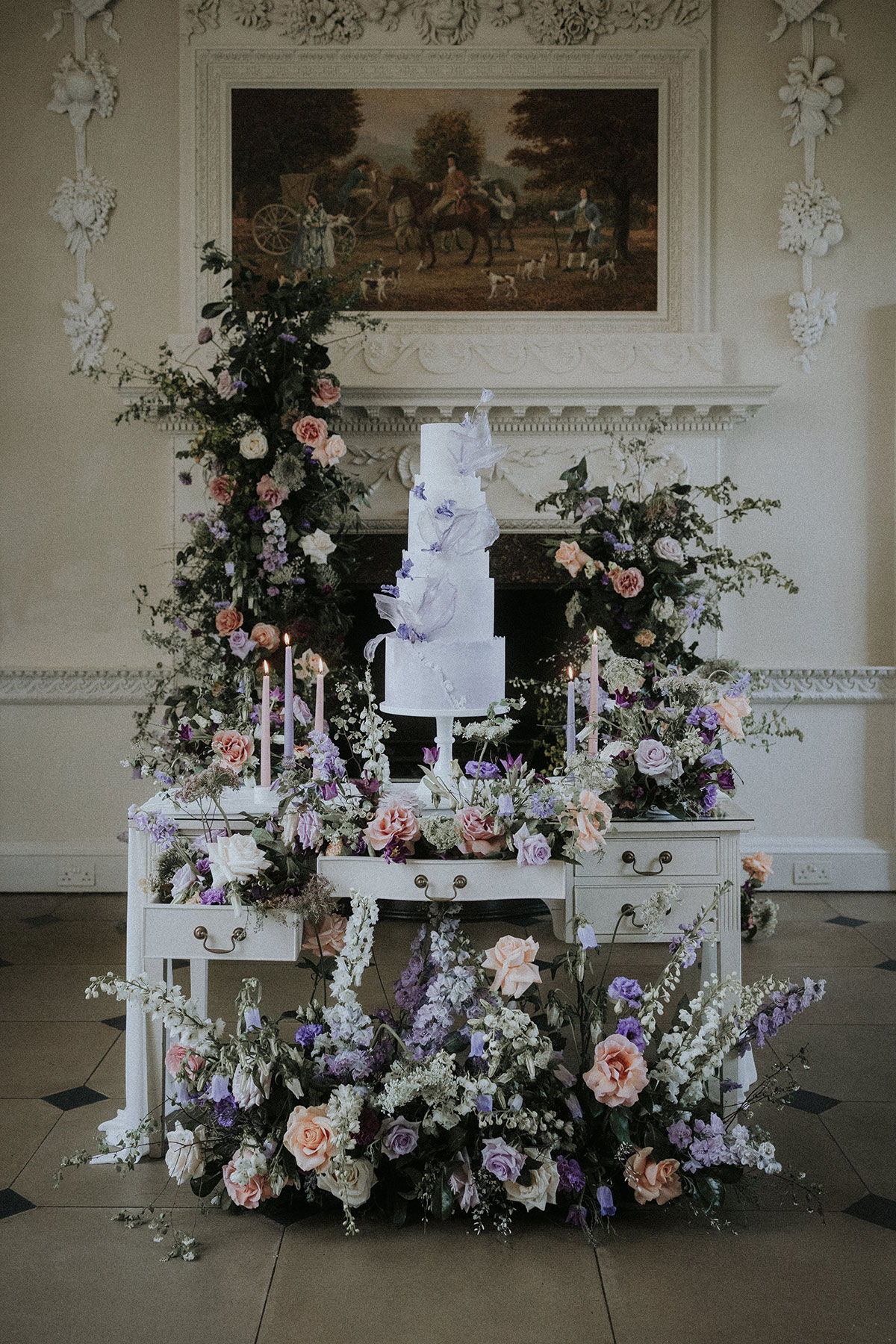 wedding cake on top of desk with floral arrangement Chatelherault shoot