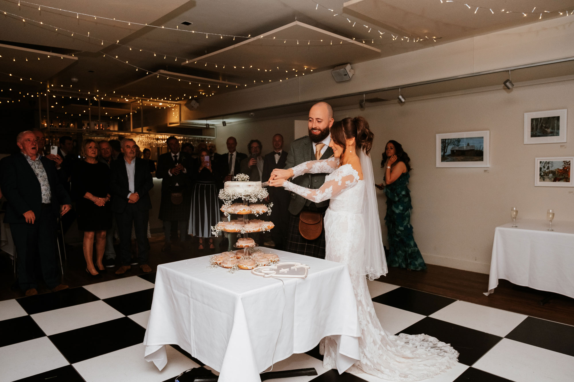 Bride and groom cut their wedding cake