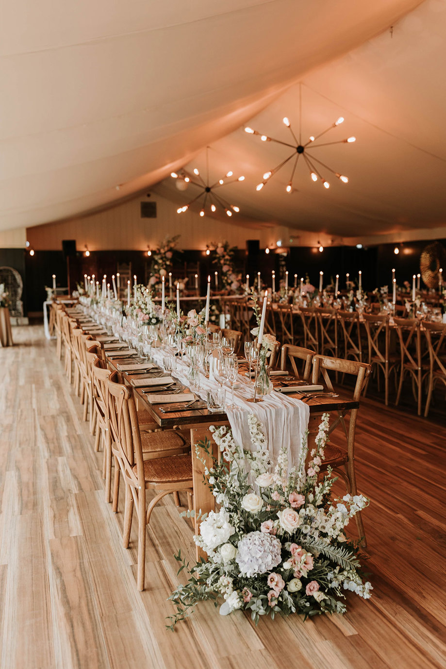 permanent marquee at Dunglass Estate dressed for a wedding reception dinner with long tables