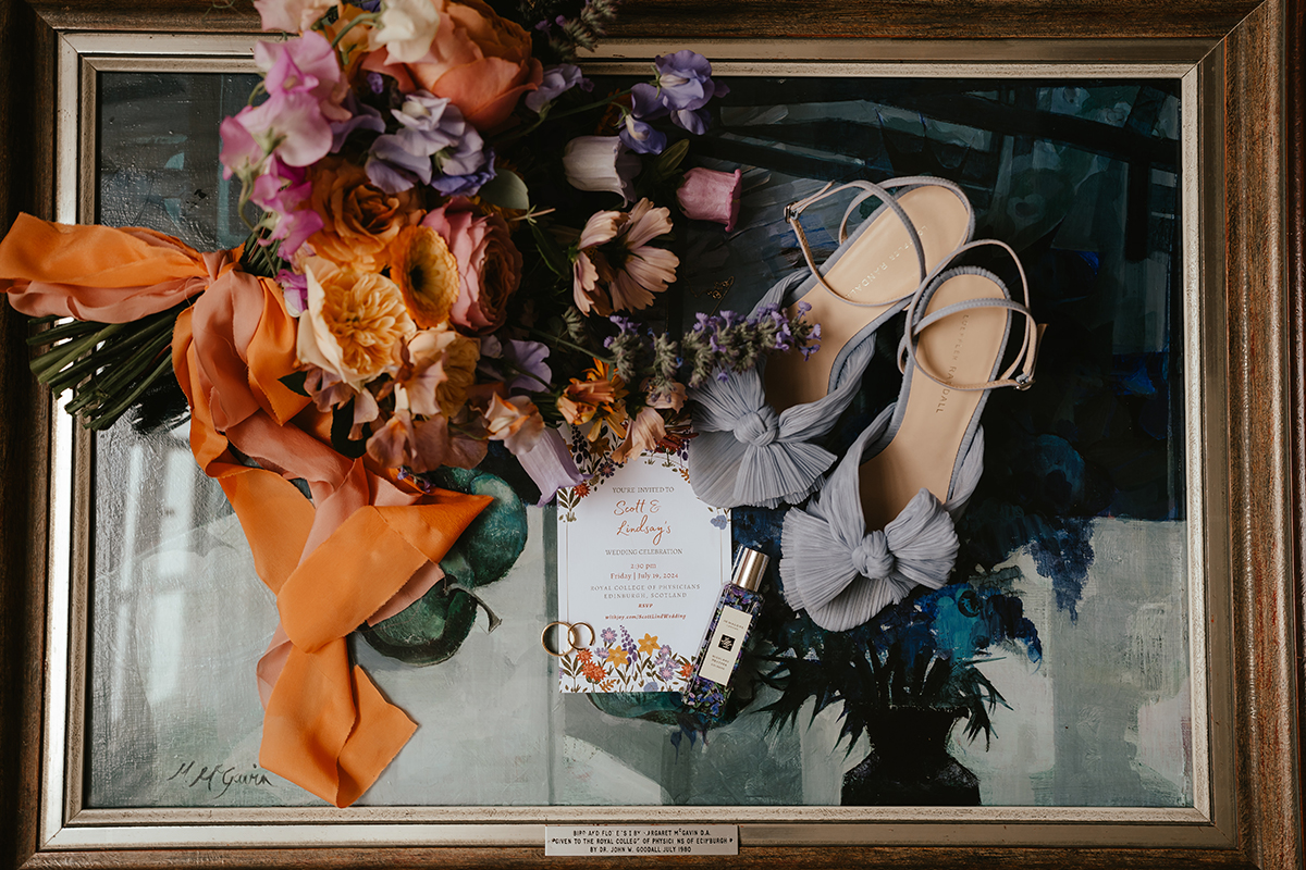 Detail shot with bouquet of orange and purple flowers