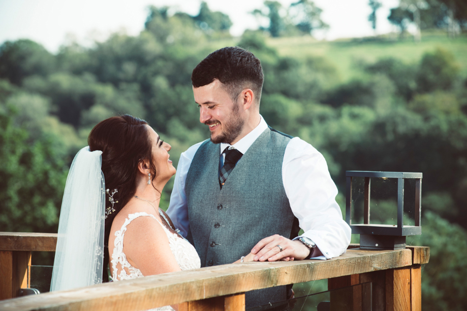 Bride and groom look at each other during couple portraits