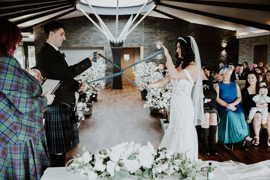 a wedding ceremony with handfasting at The Vu central Scotland sustainable wedding venue 