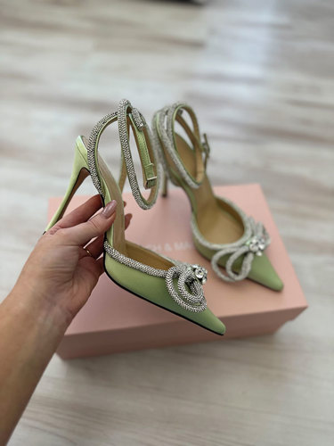 green shoes with high heels and bows in diamante detailing