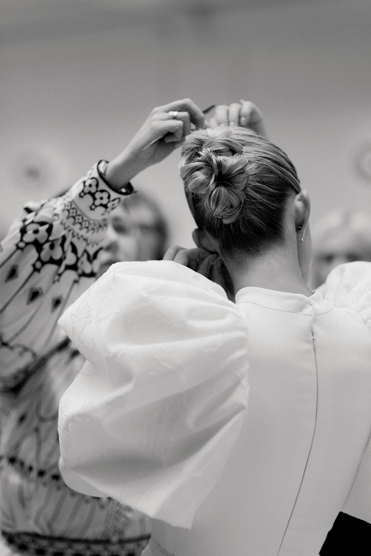 Pamela Docherty, founder of Pam Doc Hair, doing Emily Shak's hair for Tie the Knot Scotland at The Collector's Hall