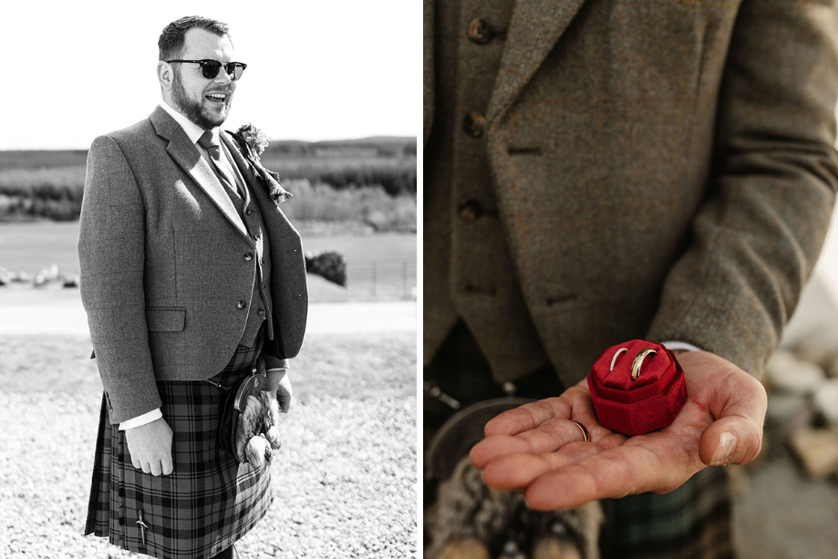 Black and white image of the groom and grooom holding ring box