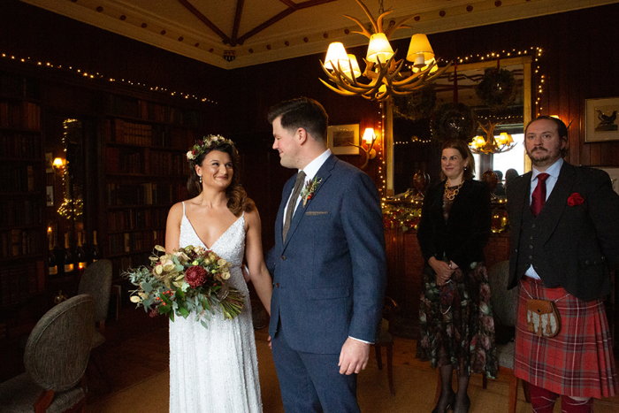 Couple smile at each other during their ceremony in The Torriden Hotel