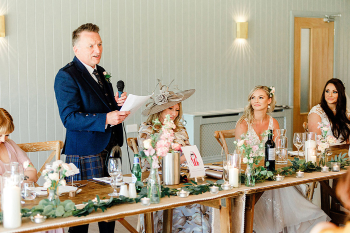 Bride's father gives a speech during reception