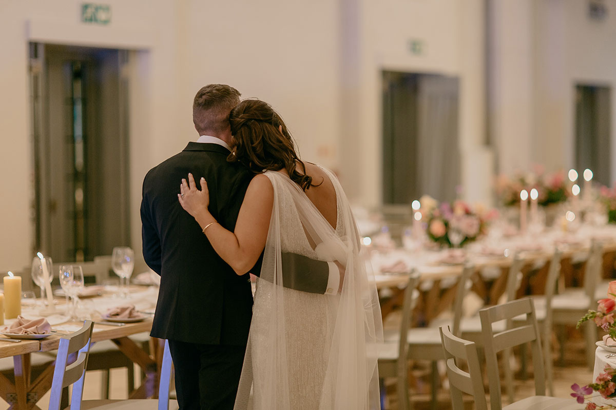 Newlyweds admiring their beautifully styled wedding reception at Boschendal Wine Estate in South Africa