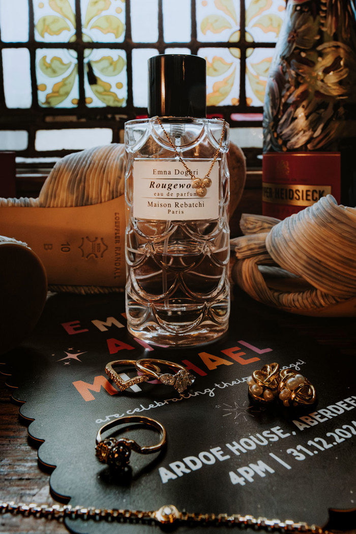 close up of wedding perfume and ardoe wedding sign