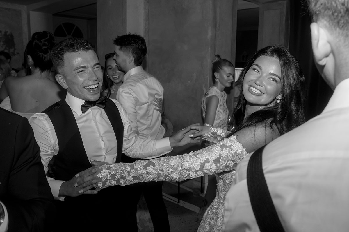 Bride and groom dancing together during their wedding reception in Lake Como.