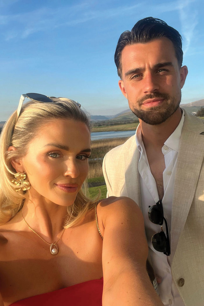 Antonia Healy and Craig Watson posing for a selfie in soft golden sunlight