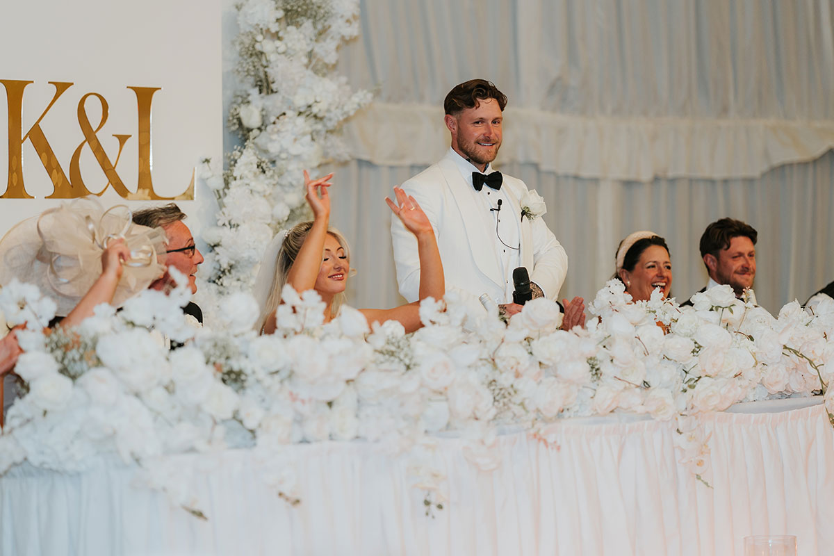 Groom giving speech at top table during Ingliston Country Club wedding reception