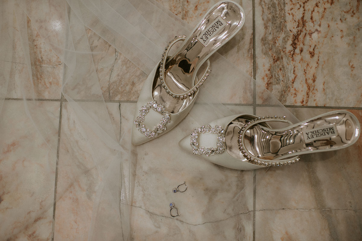 badgley mischka shoes with veil on marble floor at Achnagairn Castle